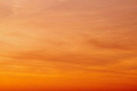The colorful clouds against the orange sky create a breathtaking landscape.の写真素材
