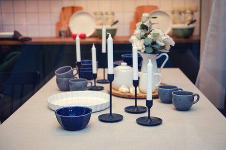 Candles and glasses on a large festive table