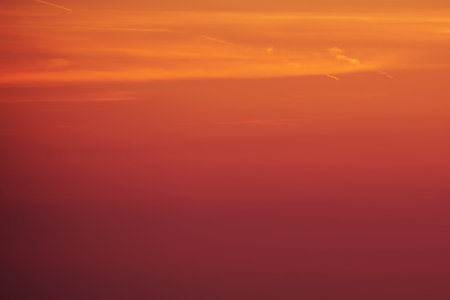 The background of the sunset was a beautiful mix of red and orange.の写真素材