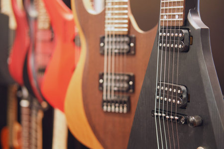 Electric guitars in a music shop. Close-up. Selective focus on electric guitar