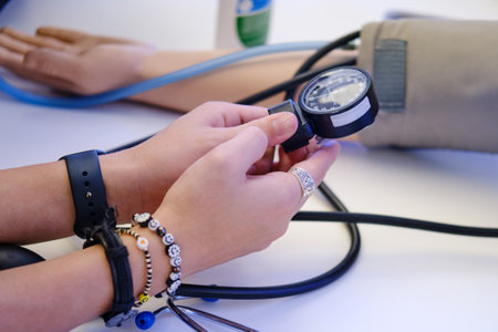 Blood pressure measuring device in doctor's hands, training dummyの写真素材