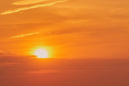 The stunning sunset paints the evening sky with a palette of warm colors.の写真素材