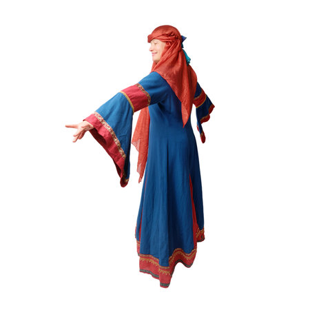 Woman in medieval European dress dancing on studio background, isolated on white background. Portrait of a beautiful middle aged woman in a medieval costumeの写真素材