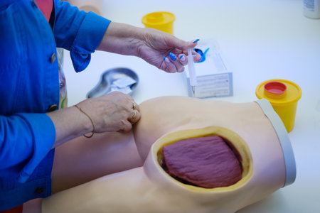 Close-up of physiotherapist treating injured buttock of patient.の写真素材