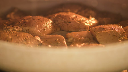 Trout fish is cooked in the oven in the home kitchenの写真素材