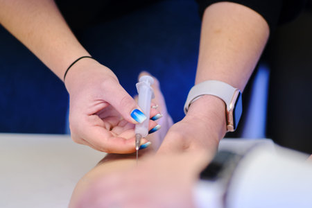Woman makes an injection in the arm of a mannequin