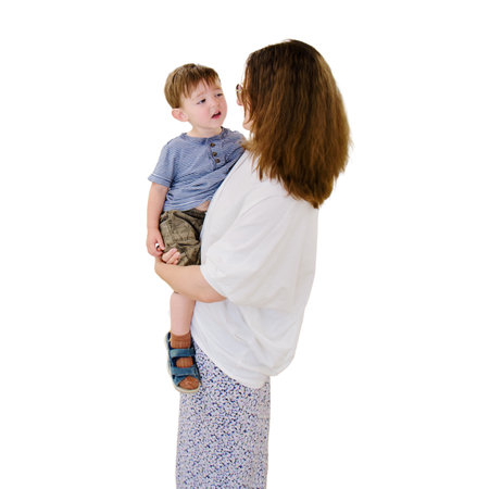 The mother and her child are in the pediatric waiting room, talking together to pass the time before their consultation with the doctor, isolated on white background. Kid boy aged two yearsの写真素材