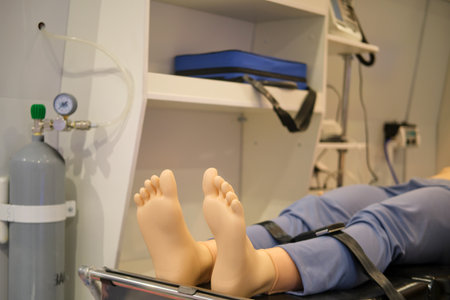 Patient lying on a stretcher in a training dummy in an ambulance. Medical equipment.の写真素材