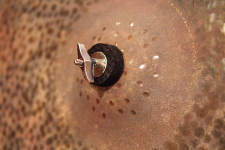 Close-up of an old rusty steel drum with a cymbalの写真素材