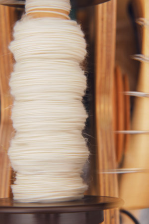 The design of the spinning wheel has a vintage look, adding to the craft's nostalgic charmの写真素材