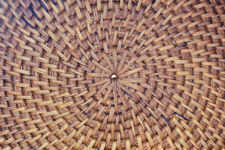 Close-up of circular wicker basket pattern. Natural texture and craft concept. Design for wallpaper,...