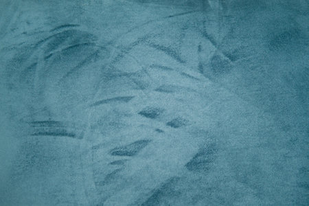 Blue textured fabric with soft patterns and shading. Abstract background for design and print.の写真素材