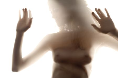 Tempting young  woman standing behind the veilの写真素材