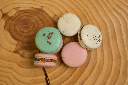 Colorful French or Italian macaron on the wood table with copy space for background. Macarons or macaroons is French dessertの写真素材