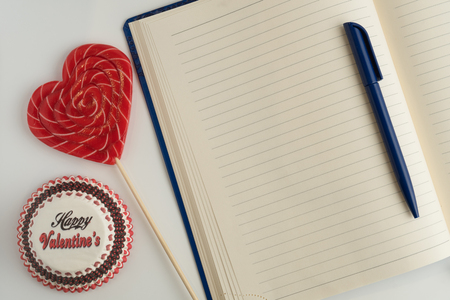 Happy Valentine's Day. Caramel heart on white background, congratulations on Valentine's Day. To-do list for Valentine's dayの写真素材