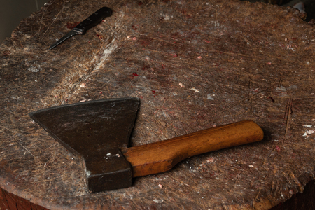 The chopping board, on it lies meat and the axeの写真素材
