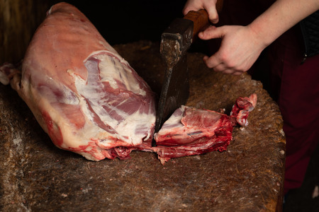 Carcass of sheep on the butcher's cutting boardの写真素材