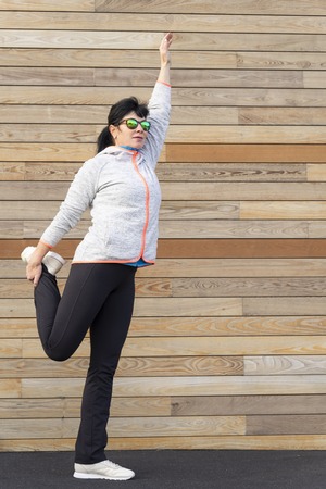 a adult woman is doing outdoor exerciseの写真素材