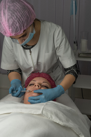 The dermatologist is doing the procedure against acne and blackheadsの写真素材