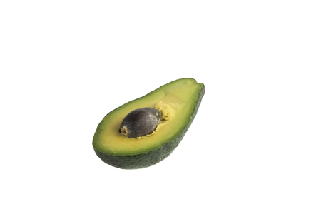 A juicy slice of green avocado on white backgroundの写真素材