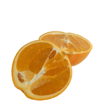 Oranges slices lie isolated on white backgroundの写真素材