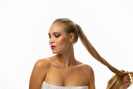 Young seductive blonde woman with stylish make-upの写真素材