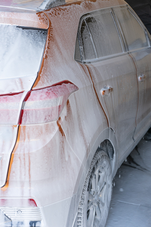 The image car in foam at the car washの写真素材
