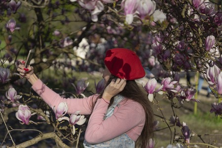 Girl taking a selfie in the Parkの写真素材