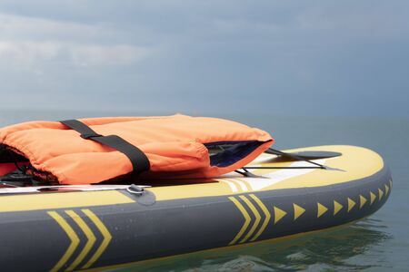 Surfboard or sup surfing close-up in the open sea. Bathing safety conceptの写真素材