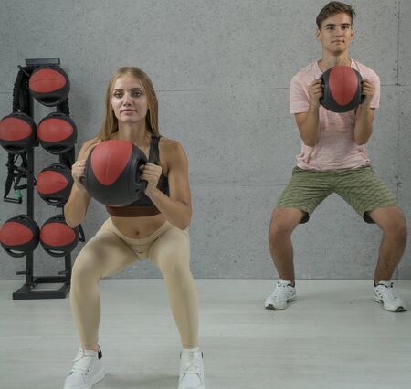 Fitball workout, exercise using balls. Group training in the fitness roomの写真素材