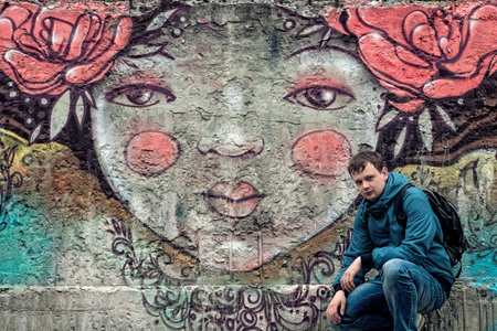 guy sitting on a background patternの写真素材