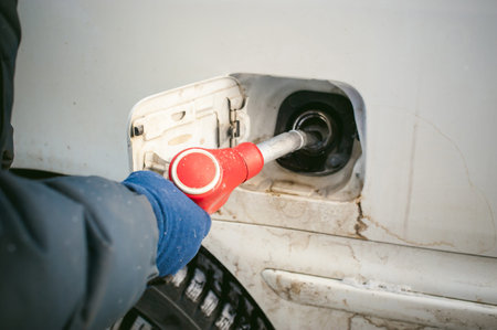 refueling nozzle is inserted in the tank car at a gas station