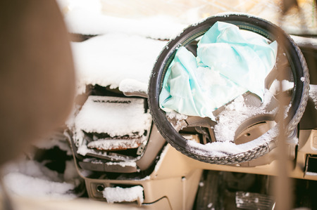 accident automobile. Salon crashed car covered with snow. Supplemental Restraint Systemの写真素材