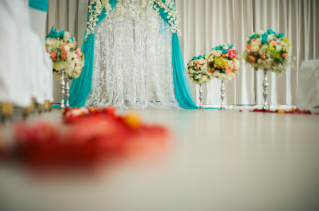 decorated festive wedding hall. a wedding arch for the wedding ceremony when the bride and groom. elegant chairs for guestsの写真素材