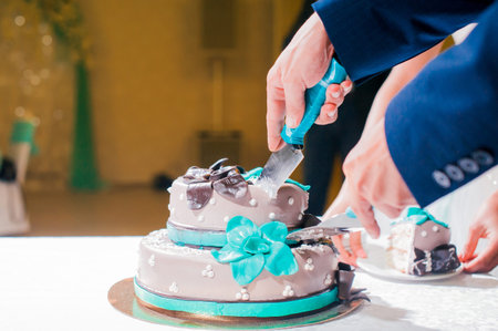 husband and wife, the couple cut the wedding cake knifeの写真素材
