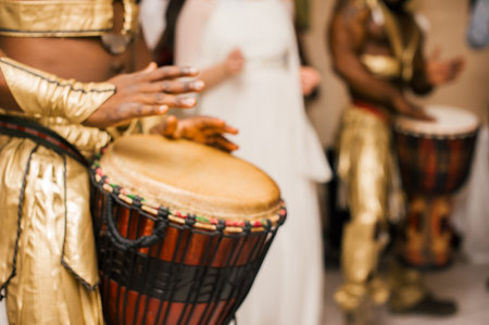 drummers pounding drums, musicians hand closeup, abstract blur