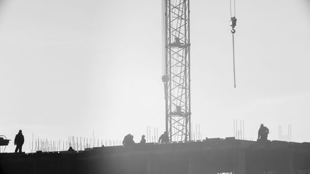 builders working on the construction site, erecting and concrete reinforcement, workflow...