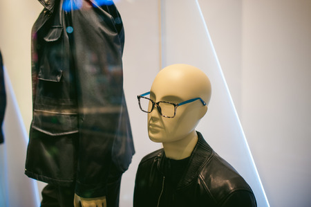 dummy on a shop window. Faceless man's glassesの写真素材