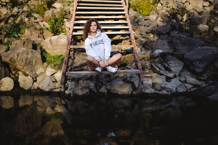 lovely young woman with curly hair, the romance of youth, a journey walk on a warm summer sunny day...