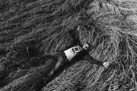 man on a background of landscape fields, wheatの写真素材