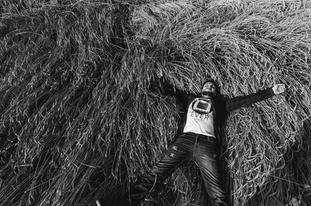 man on a background of landscape fields, wheatの写真素材