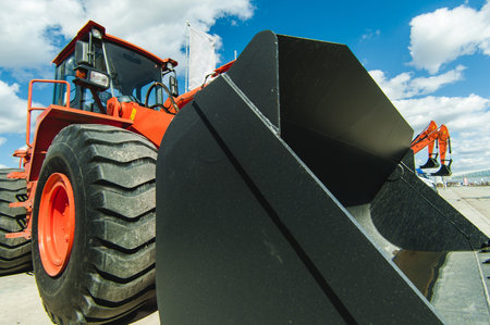 Excavator Loader Machine. Side View of Front Hoe Loader. Industrial Vehicle. Heavy Equipment...