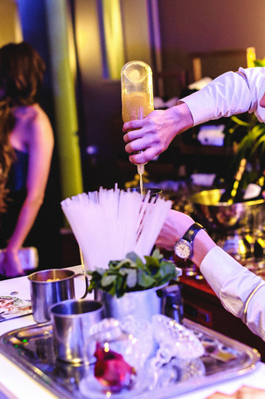 people are resting at a banquet. the barman pours drinksの写真素材