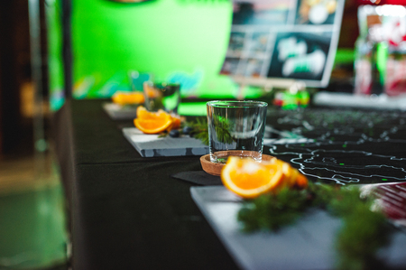 decorative serving, table setting for a coffee drink. slices of citrus oranges and a glass beakerの写真素材