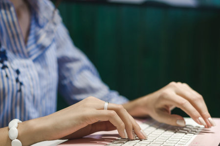 Workplace women working behind a laptop in a cafe. job online young beautiful brunette