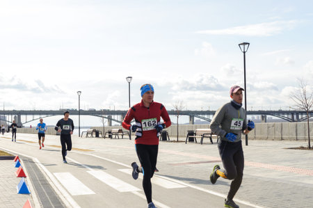 Russia, Novosibirsk - December 14, 2019: Spring Run on the Quay. group of people participate in a...