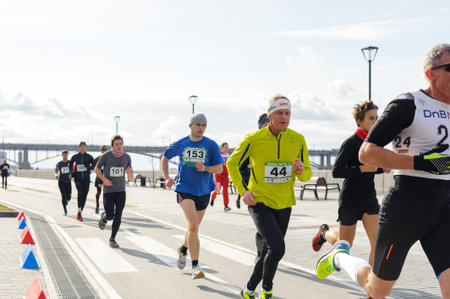 Russia, Novosibirsk - December 14, 2019: Spring Run on the Quay. group of people participate in a...