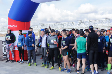 Russia, Novosibirsk - December 14, 2019: Spring Run on the Quay. group of people participate in a...