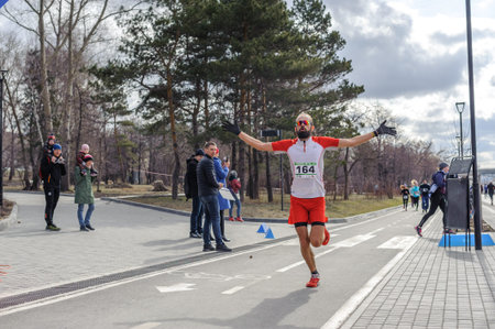Russia, Novosibirsk - December 14, 2019: Spring Run on the Quay. group of people participate in a...