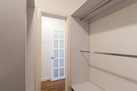 Russia, Moscow- June 15, 2018: interior room apartment. standard repair decoration in hostel. dressing room, hangers, storage systemのeditorial素材